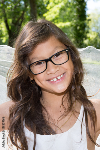 cheerful young girl smiling with glasses
