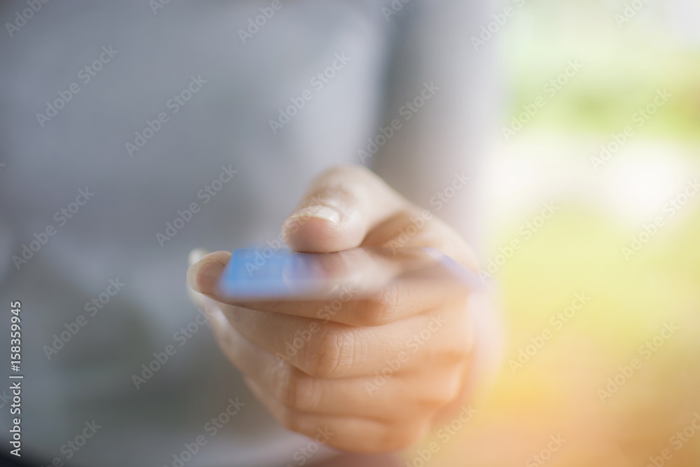 Close up of hand of woman holding credit card