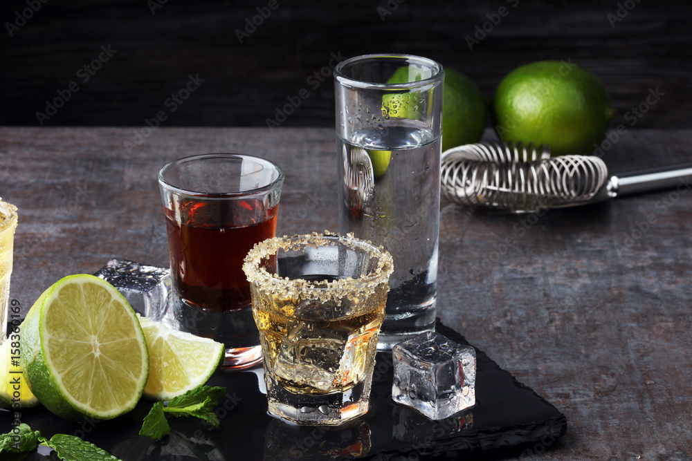 Selection of alcoholic drinks on rustic stone plate Selection of alcoholic drinks on rustic stone plate