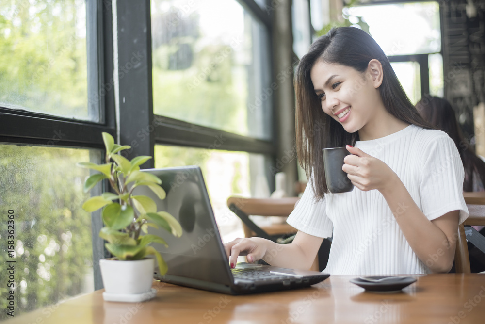 Beautiful business girl working with tablet , smartphone and drinking coffee in coffee shop Beautiful business girl working with tablet , smartphone and drinking coffee in coffee shop