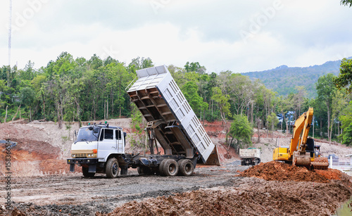 Truck on Reservoir construction site with mountain and sky