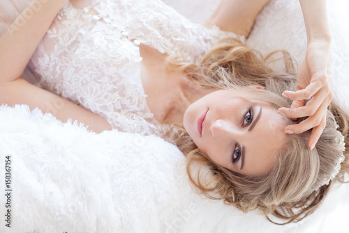 Portrait of a beautiful girl lying on a sofa photo