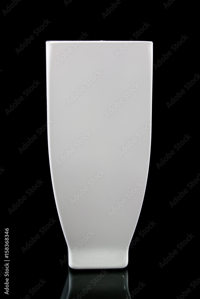 White Elegant Tall Vase for Your Flowers on a blackblackground White Elegant Tall Vase for Your Flowers on a blackblackground
