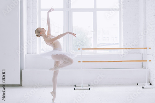 Fototapeta Naklejka Na Ścianę i Meble -  Young ballerina in ballet class