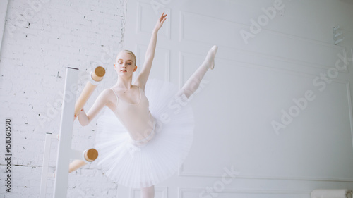 Young ballerina in ballet class photo