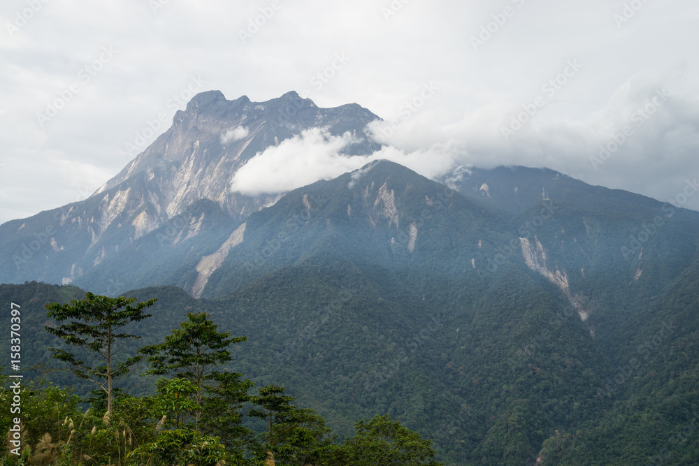 Fototapeta premium View part of Mount Kinabalu from Kundasang village, Sabah. The highest mountain in Malaysia with elevation is 4095m and it famous among tourist.