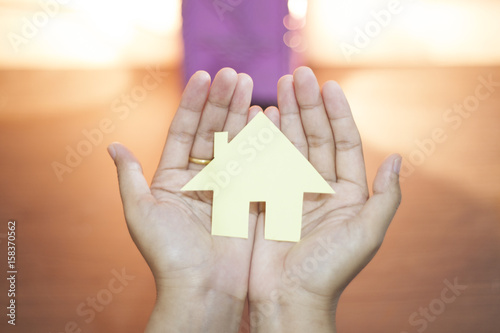 Hand Holding paper House