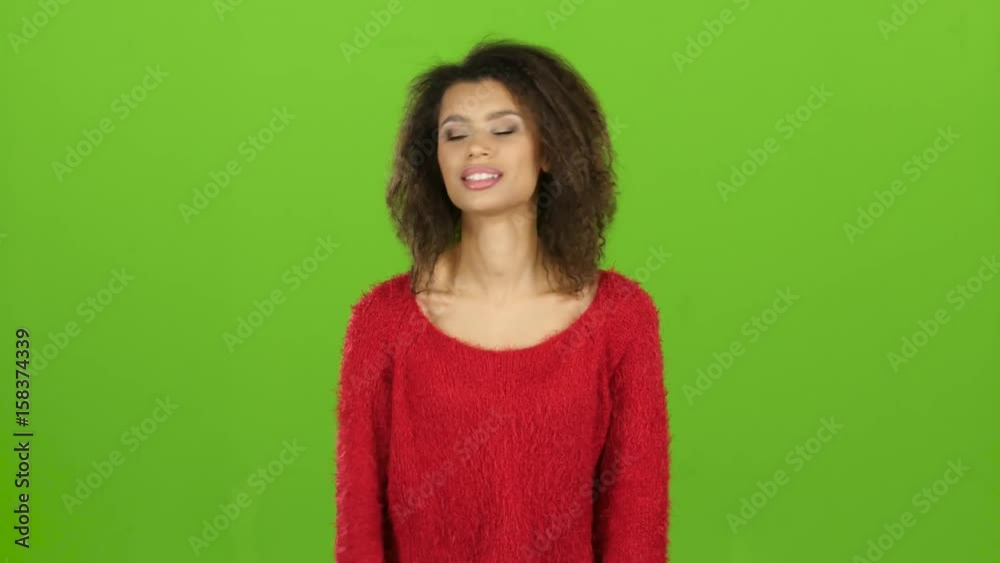 Afro american woman exhibits emotions of nervousness, irritability. Green screen Afro american woman exhibits emotions of nervousness, irritability. Green screen