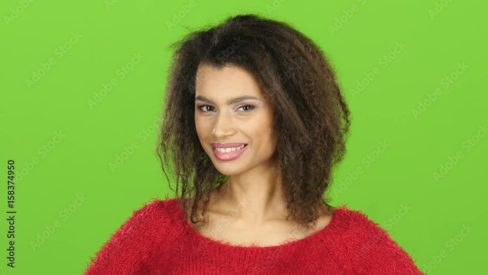 Afro american woman flirts and winks at eye, green screen Afro american woman flirts and winks at eye, green screen