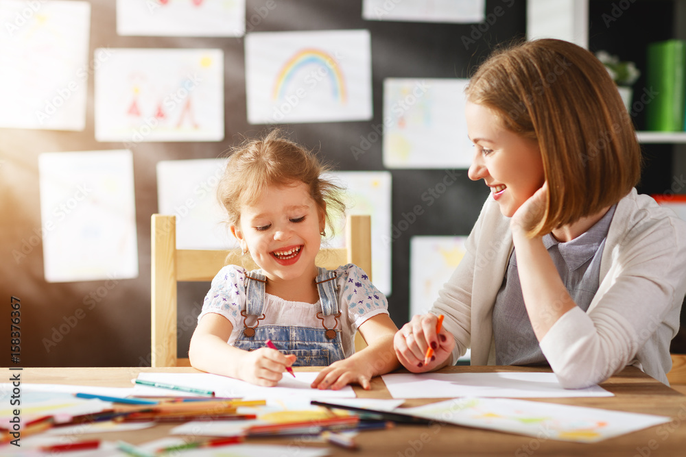 mother and child daughter draws in creativity in kindergarten mother and child daughter draws in creativity in kindergarten