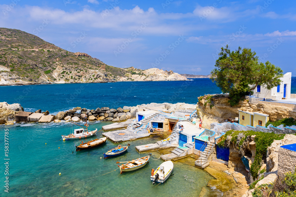 Obraz premium Picturesque fishing village of Mandrakia with traditional shelters for the boats (sirmata), Milos Island. Greece.