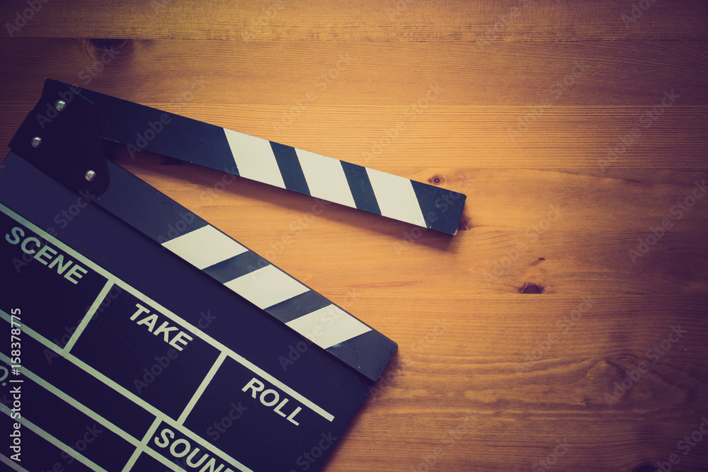 Obraz premium movie clapper on wood table