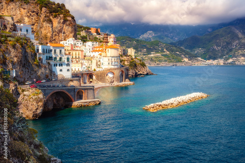 Cityscape view of Amalfi with colorful houses and the ocean
