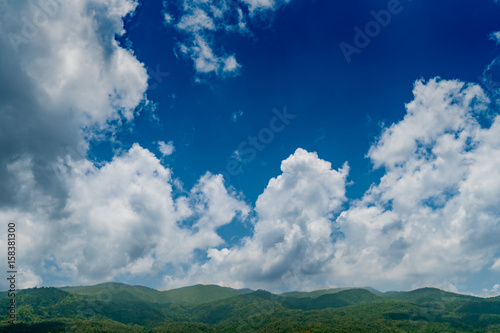 Mountain with white cloud on Blue sky © santagig