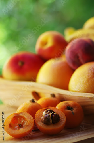 Loquat medlar with nany fruits in basket
