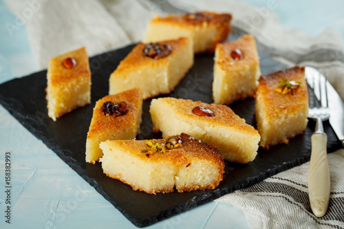 Arab traditional basbousa with different nuts. Eastern dessert from semolina.