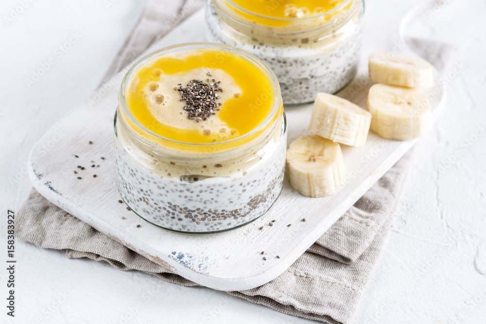Fototapeta premium Chia seed pudding in glass jar. Superfoods concept with copy space. Healthy vegan food