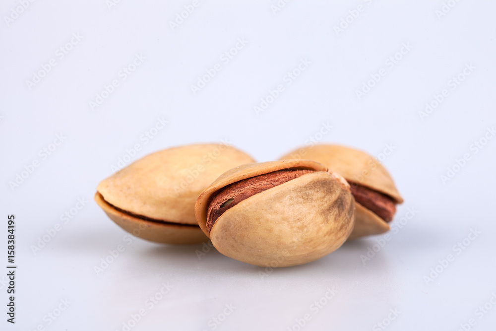 three almonds on white background three almonds on white background