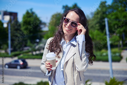 Obraz na plátně Beautiful lade smiling and drinking coffee