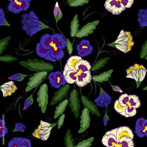 Embroidery pansies, seamless floral pattern . Vector traditional folk ornament with flowers on black background for clothes design.