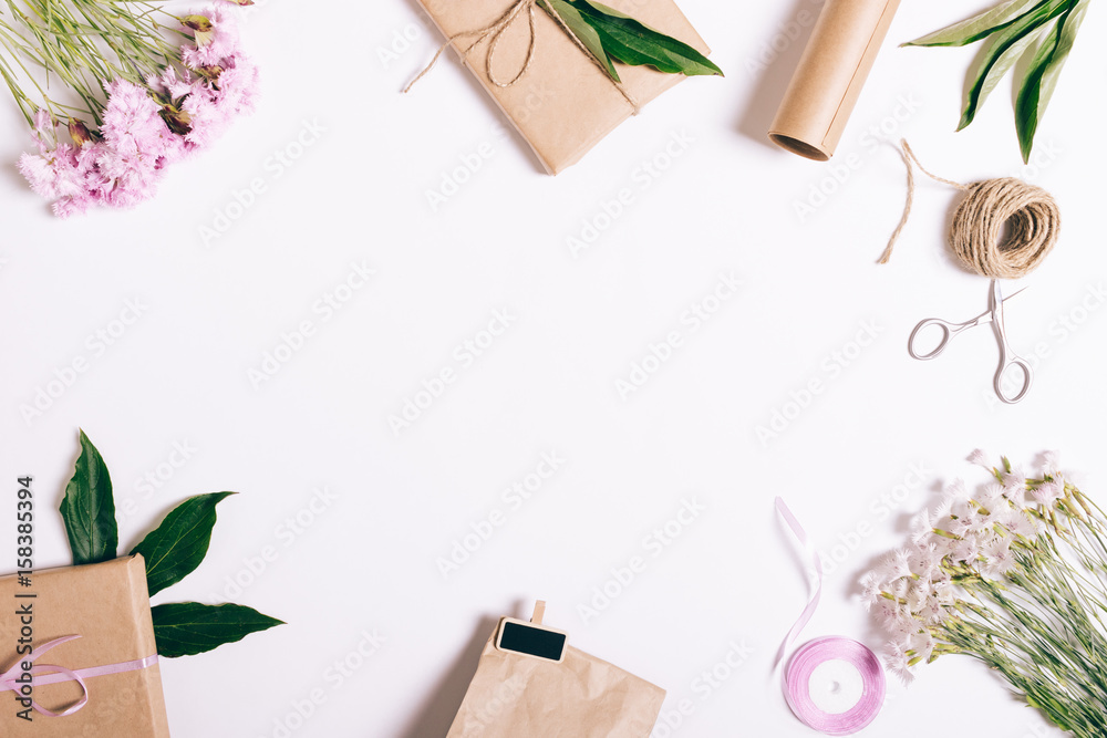 Festive floral arrangement on white background with frame for text Festive floral arrangement on white background with frame for text