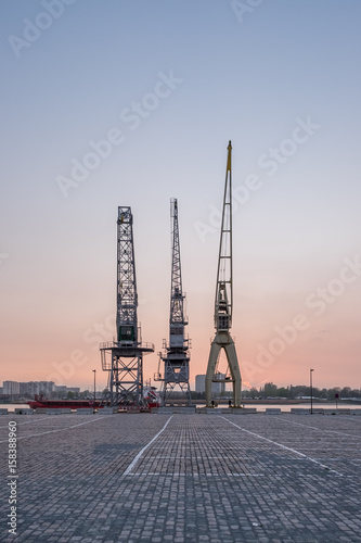 Old harbor cranes in the Antwerp district known as Eilandje. photo