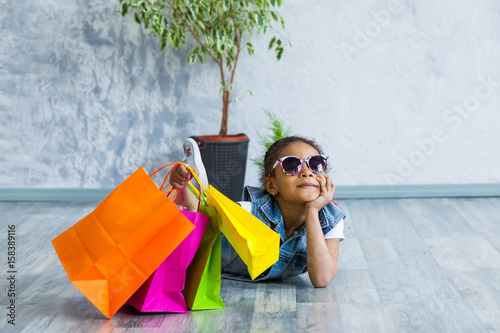 Happy afro girl with shopping bags