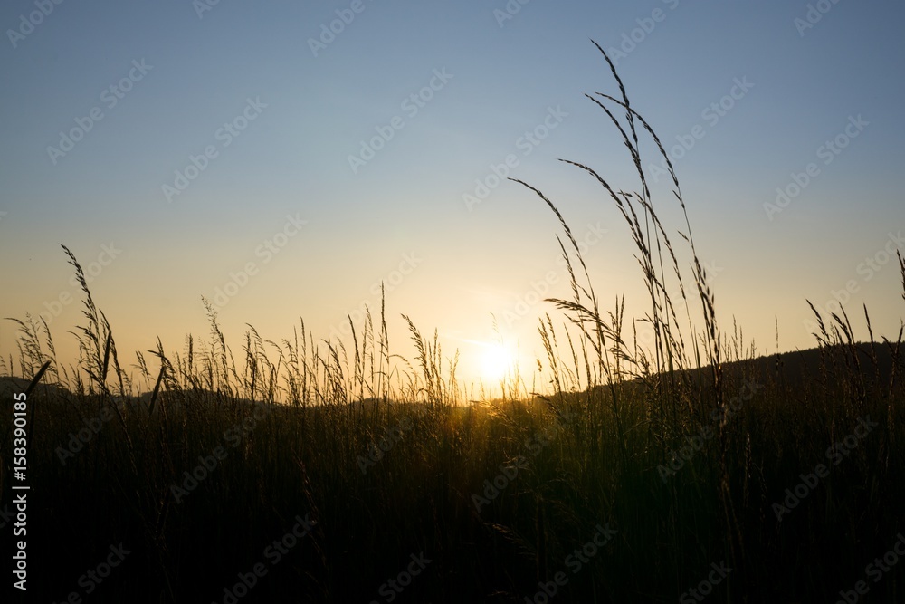 Fototapeta premium Sunrise and sunset over the hills and town. Slovakia