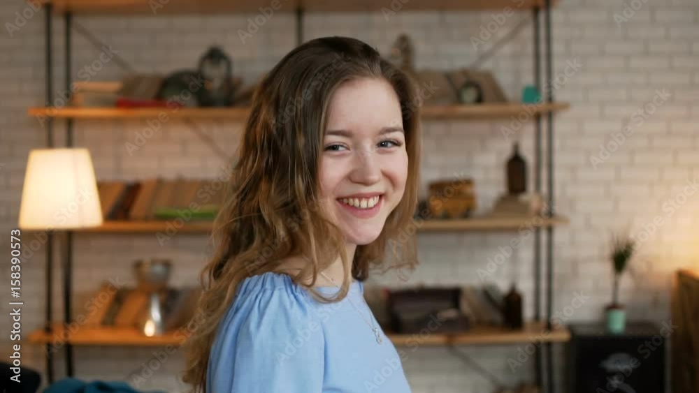 portrait of young cute and enamored woman with long blonde hair smile flirty and glancing with shy to the camera portrait of young cute and enamored woman with long blonde hair smile flirty and glancing with shy to the camera