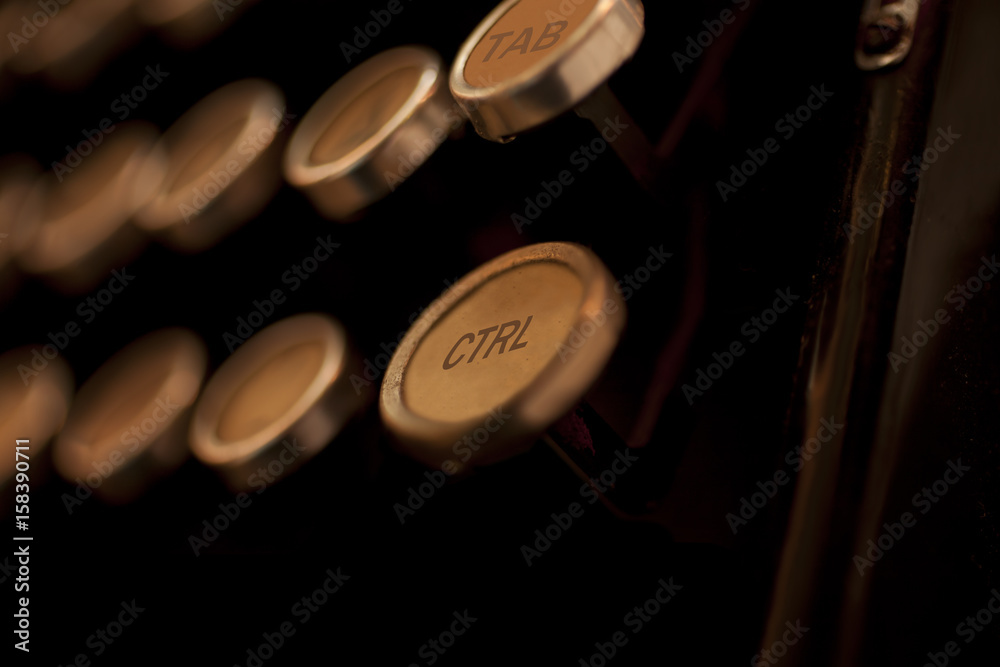 Close-up of control tab on mechanical desktop typewriter