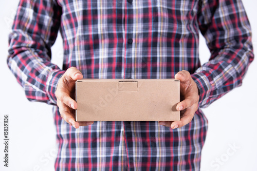 Side view of delivery man with box