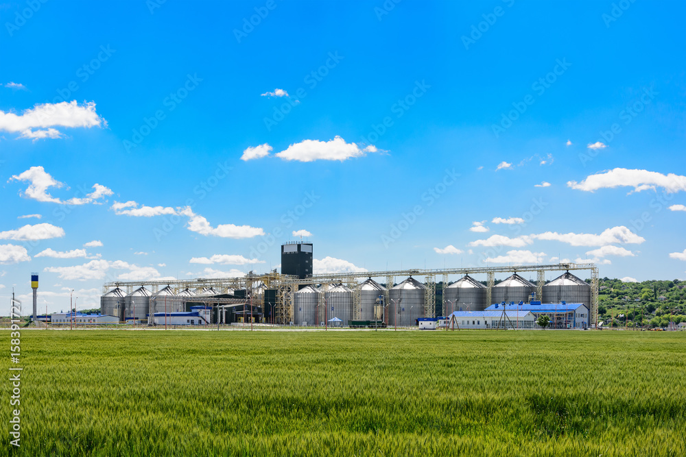 Grain elevator in agricultural zone. Granary with mechanical equipment