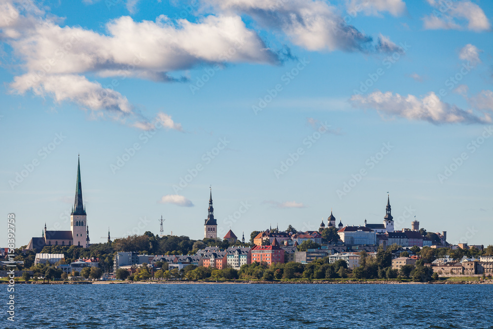 Scenic summer view of the Old Town architecture and sea old harbor in Tallinn, Estonia