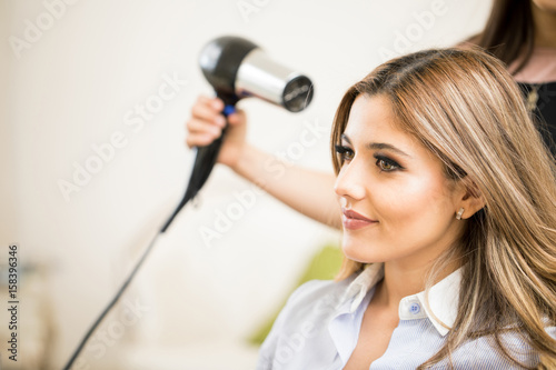 Woman enjoying her visit to a hair salon