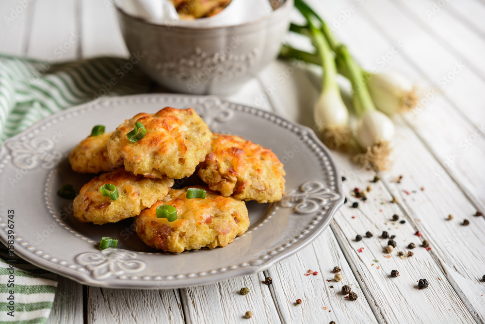 Baked small pies with ham and topped with cheese Baked small pies with ham and topped with cheese