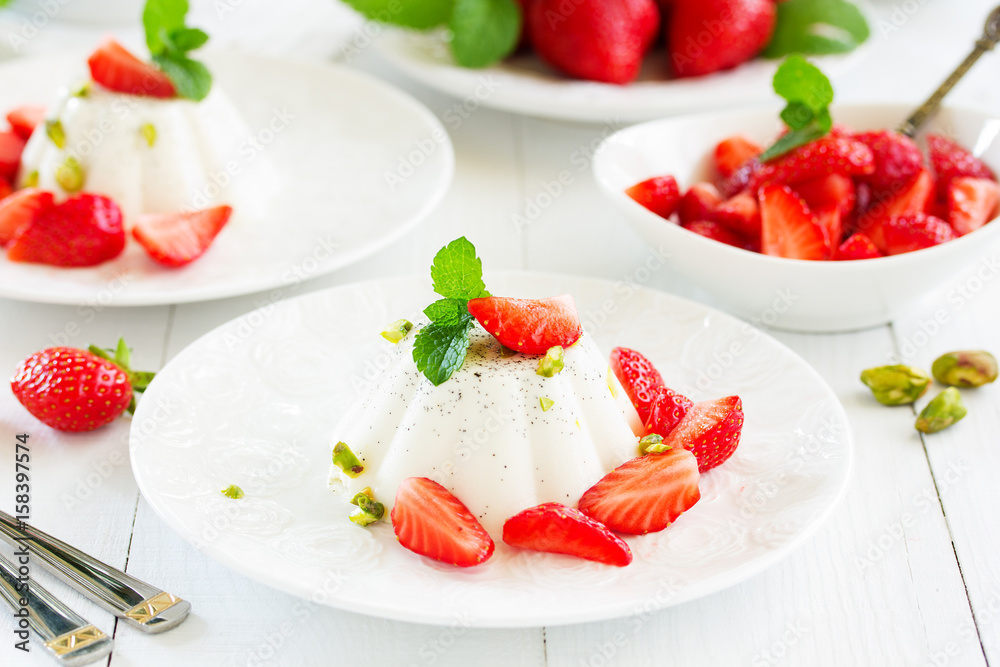 Creamy panna cotta with strawberries.