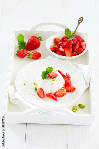 Creamy panna cotta with strawberries.