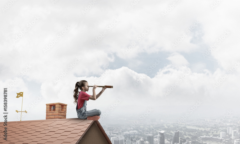 Concept of careless happy childhood with girl exploring this wor Concept of careless happy childhood with girl exploring this wor
