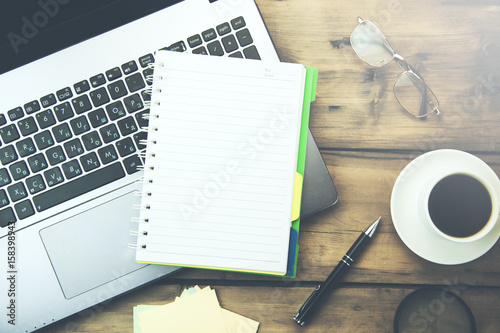 notebook and stationary on desk