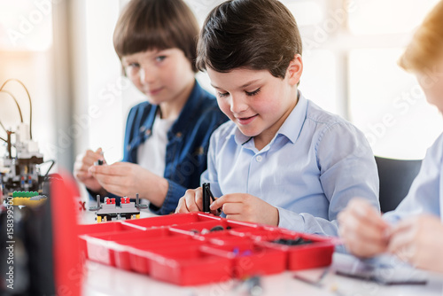 Smart young male children in workshop