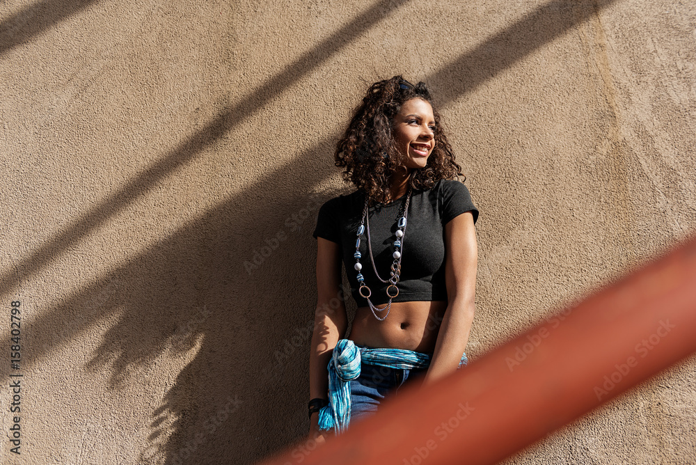 Naklejka premium Fashionable girl posing on stairs