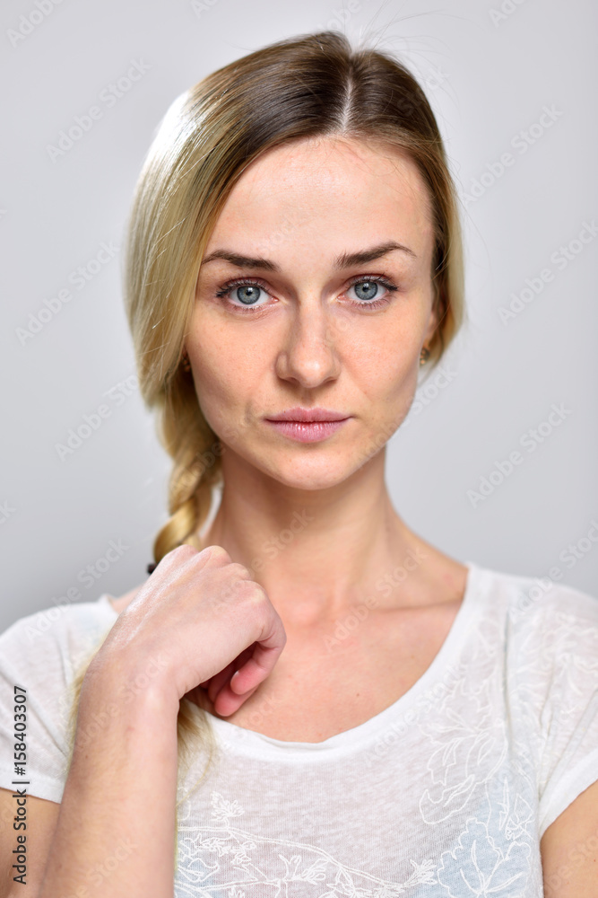 Portrait serious girl on a white background