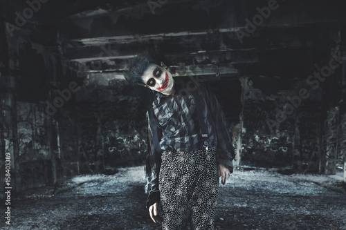 creepy clown in a dark house