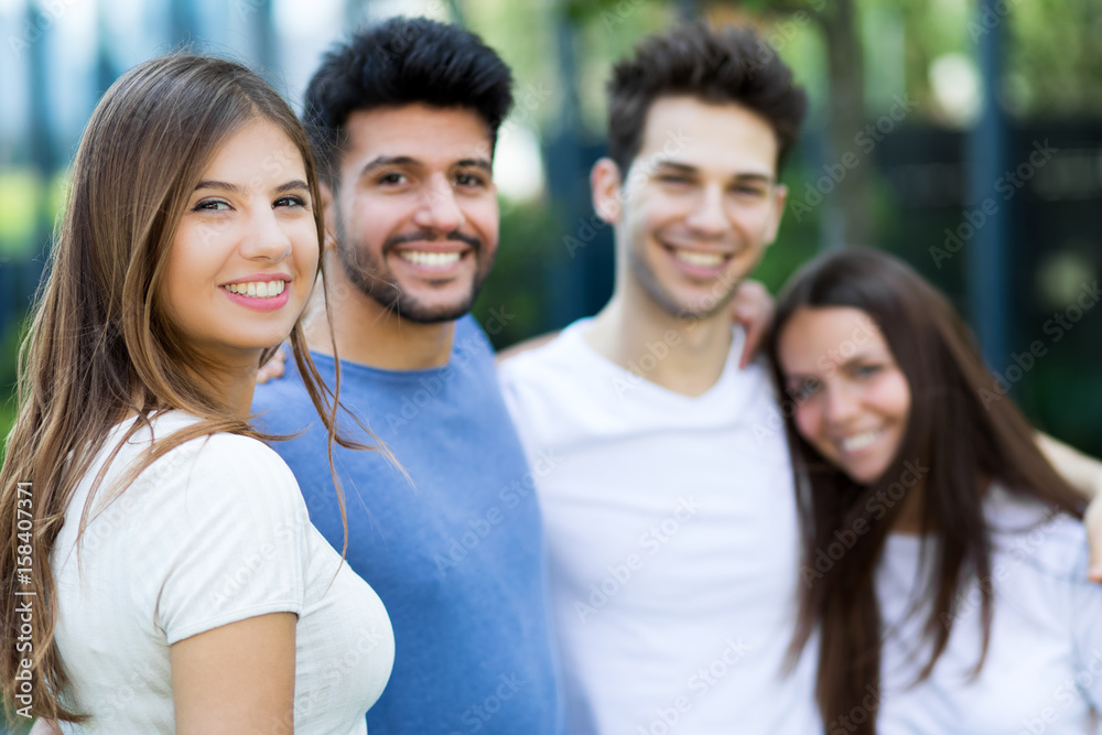 Group of friends smiling outdoor Group of friends smiling outdoor