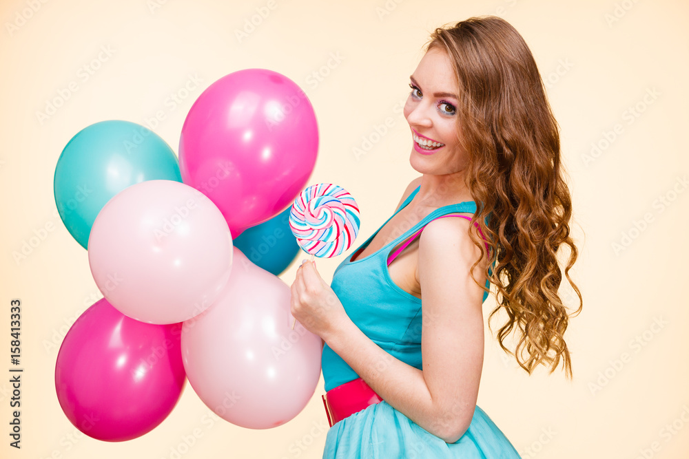 Woman with colorful balloons and lollipop Woman with colorful balloons and lollipop