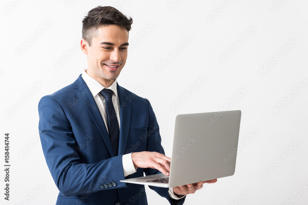 Outgoing male working with notebook computer Outgoing male working with notebook computer