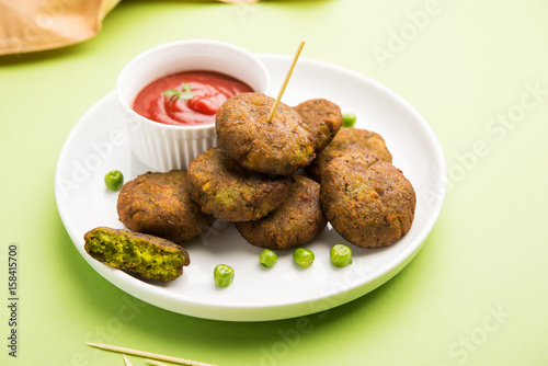 hara bhara kabab or green peas pakode, favourite indian starter menu or snacks photo