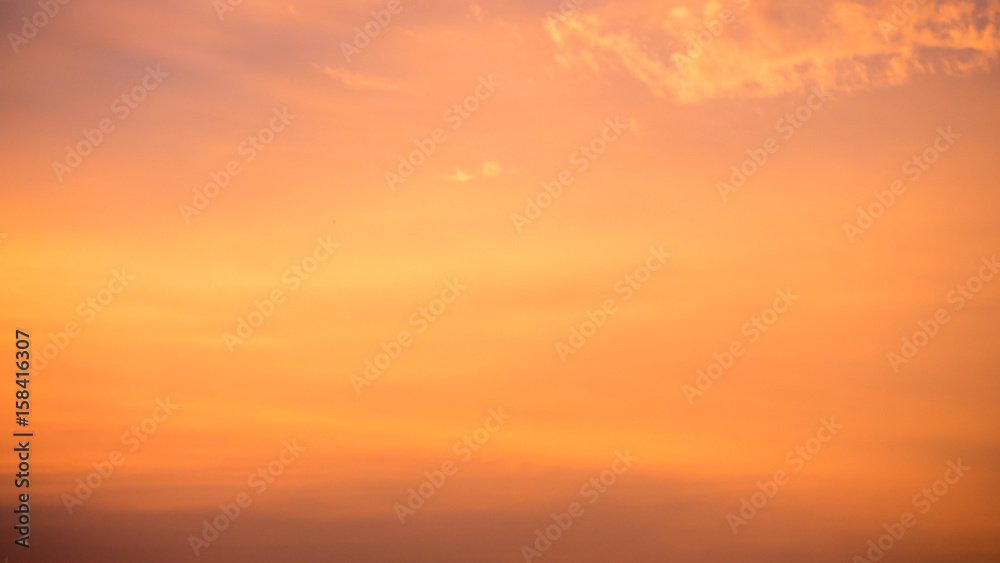 Orange cloudy sky with evening sun background