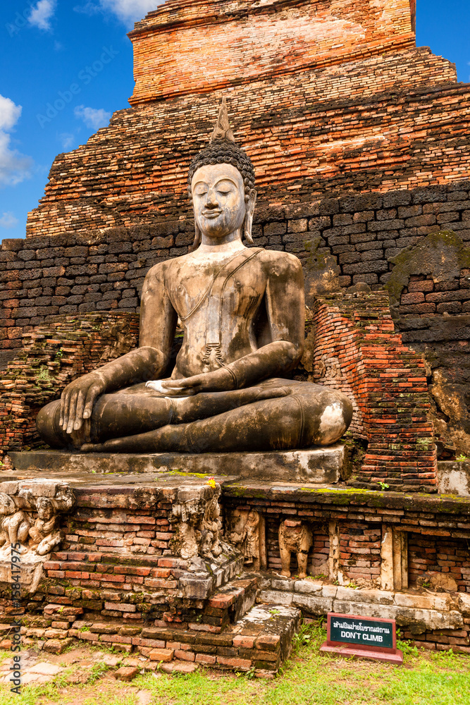 Big Buddha statue at Wat Mahathat (temple). Sukhothai Historical Park, Thailand. Unesco World Heritage Site Big Buddha statue at Wat Mahathat (temple). Sukhothai Historical Park, Thailand. Unesco World Heritage Site