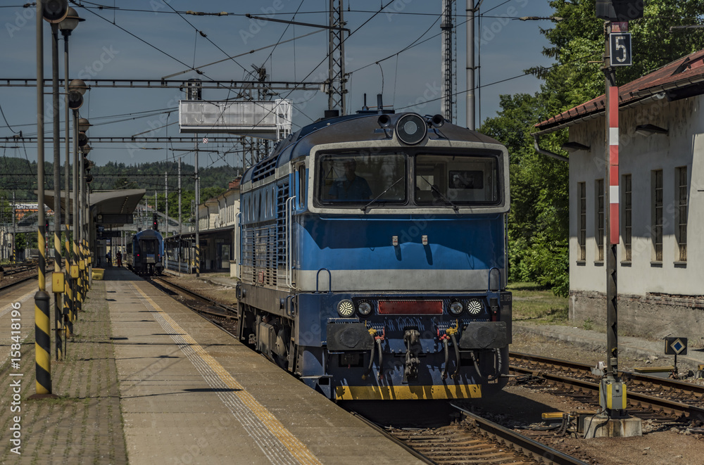 Blue motor engine near fast train